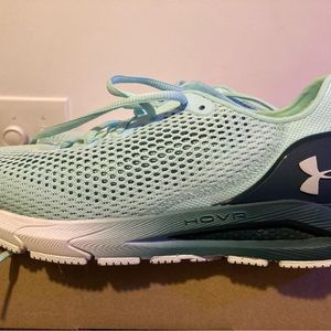 Worn once. Like new under armor womens sneakers. Light and dark teal in color.